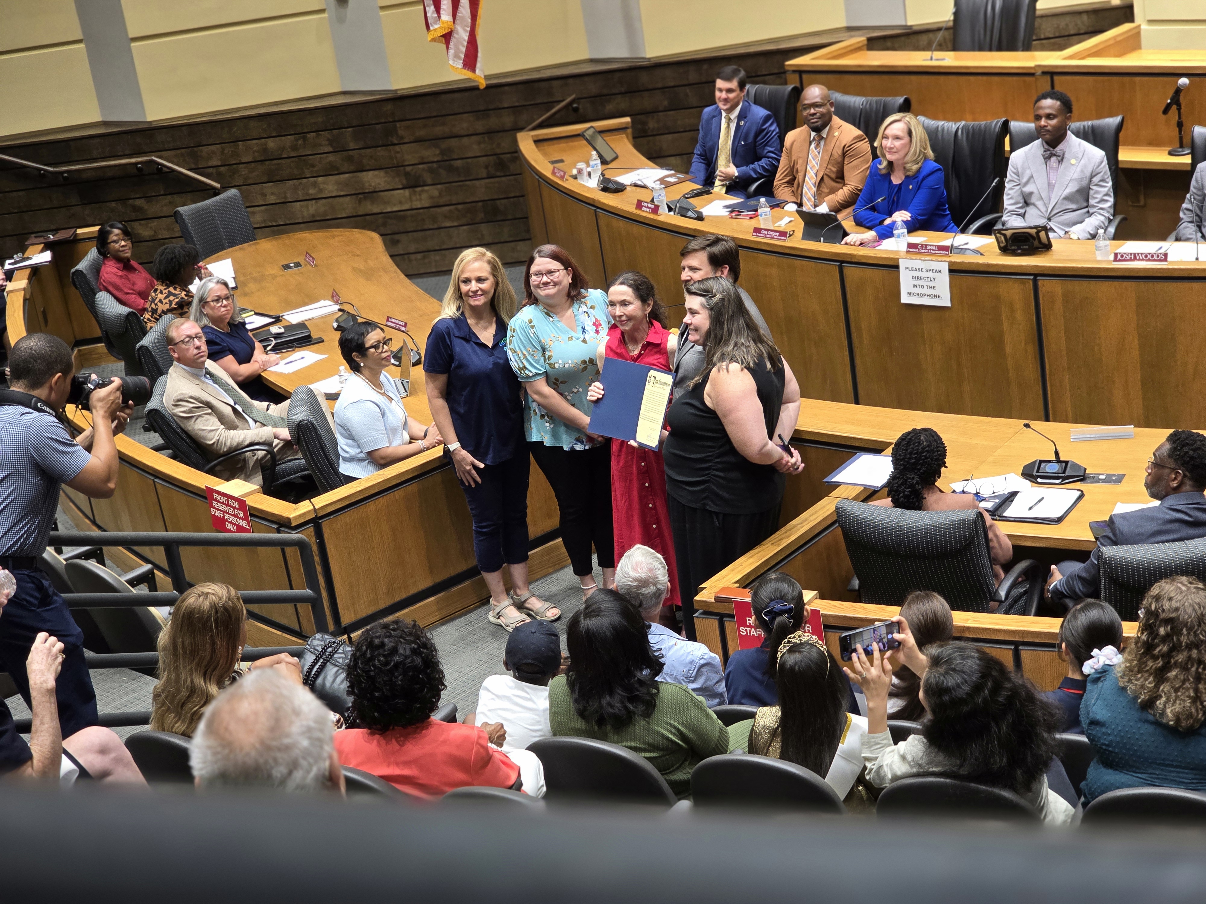 Organization representatives accepting the Proclamation from Mayor Spiro Cheriogotis at the Mobile City Council meeting recognizing the 36th anniversary of the Americans with Disabilities Act and ADA Awareness Day in the City of Mobile.